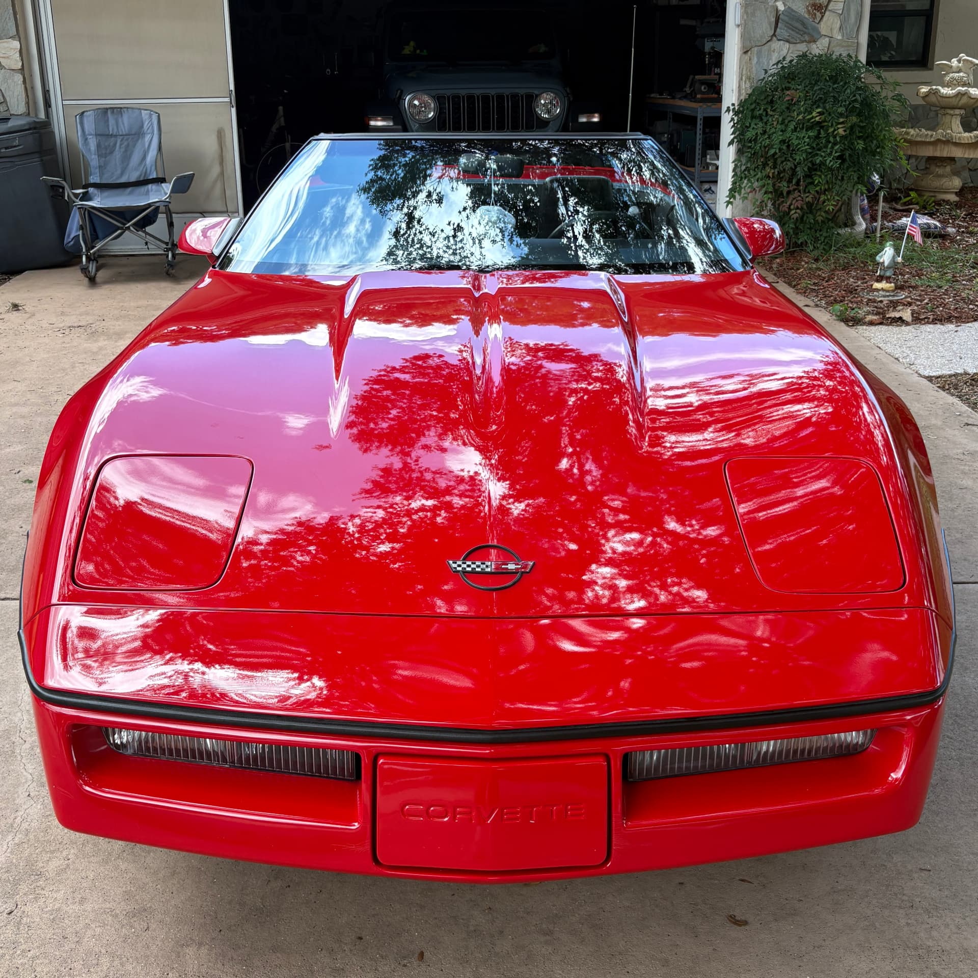 Glossy red Corvette hood after paint correction by ServiceHub Solutions