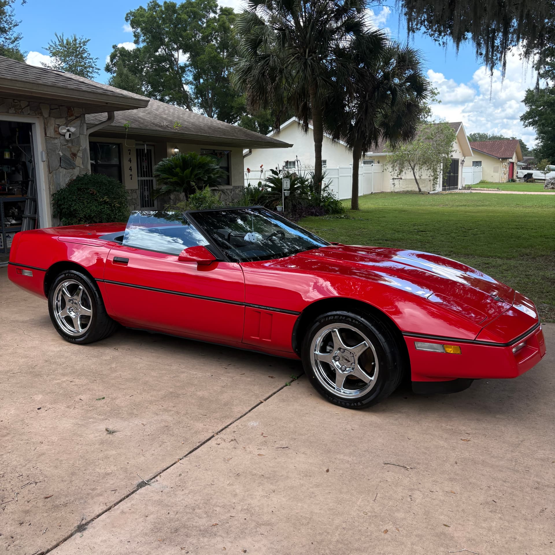 Red Corvette convertible after a full paint correction